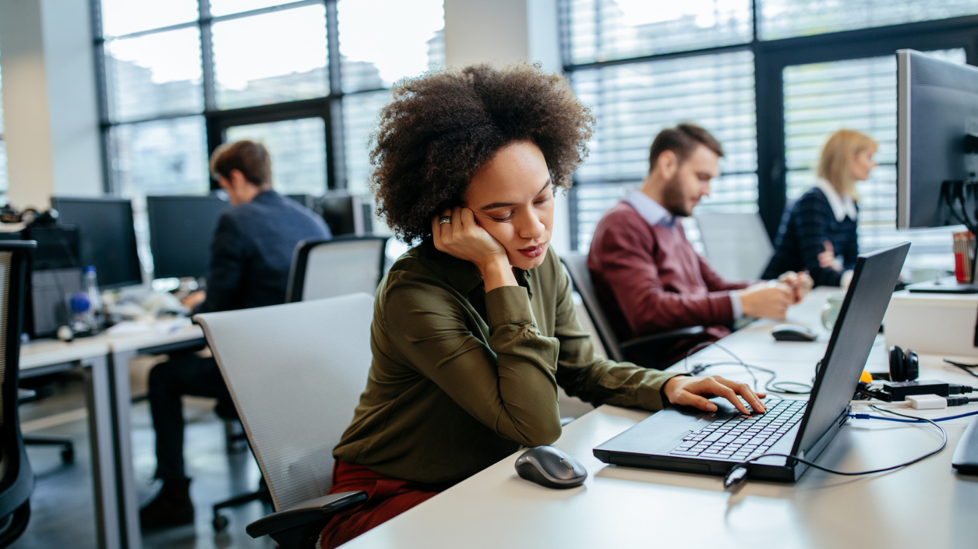 Image of person falling asleep at desk